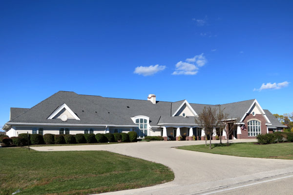 External view of front of Matthews Senior Living facility in Pewaukee